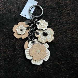 Coach tea rose bag charm.